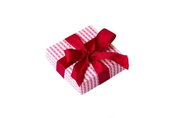 Small paper giftbox with red bow, isolated — Stock Photo, Image