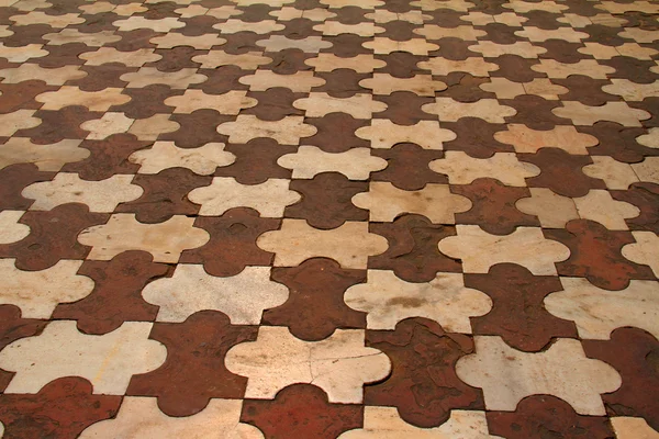 Puzzle shaped tiles — Stock Photo, Image