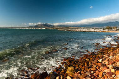 The mountains and harbour at Gordons Bay near Cape Town clipart