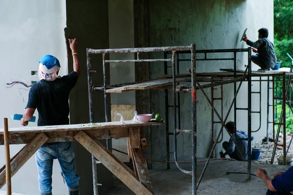 Rear View Workers Plastering Cement Surface Wall Construction Site — Stock Photo, Image