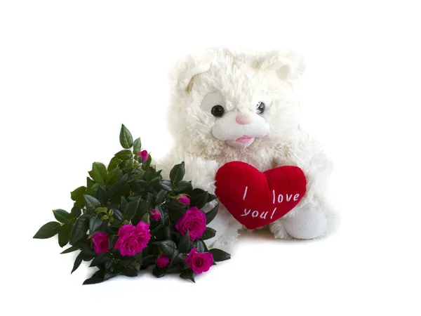 Teddy bear, red velvet heart and bouquet of roses — Stock Photo, Image