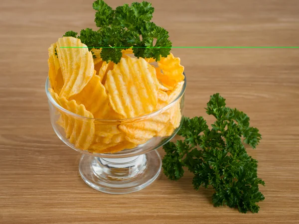 Chips are in white plate — Stock Fotó