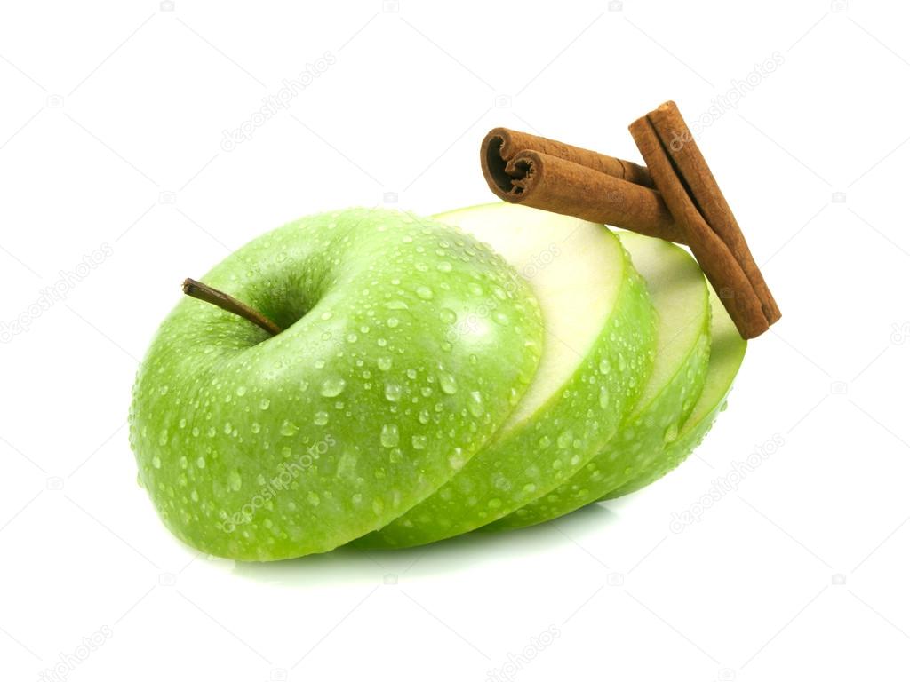 Isolated green apple slices with cinnamon pods