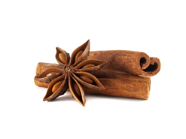 Cinnamon sticks and anise star. On white. — Stock Photo, Image