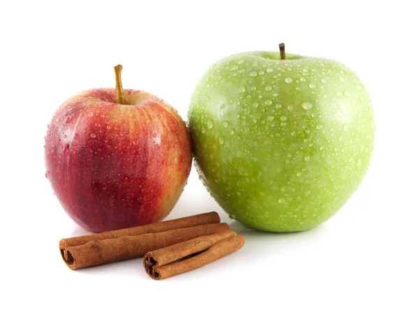 Isolated wet green and red apple with cinnamon — Stock Photo, Image