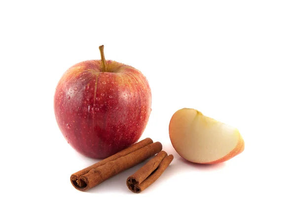 Isolated red apple with slices and cinnamon — Stock Photo, Image