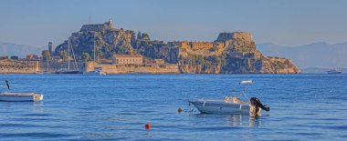 CORFU, GREECE, SEPTEMBER 28, 2019: Famous historic Venetian fortress viewed from old harbor in early morning.