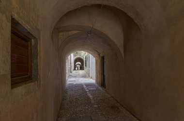 A small narrow stone street with vaults in the old town of Dubrovnik