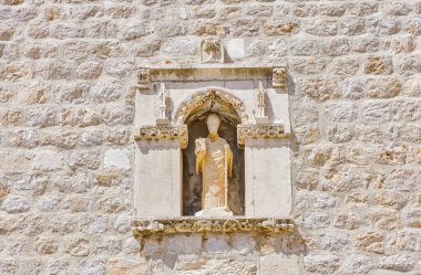 Medieval statue of saint Blasius patron of Dubrovnik at city walls.