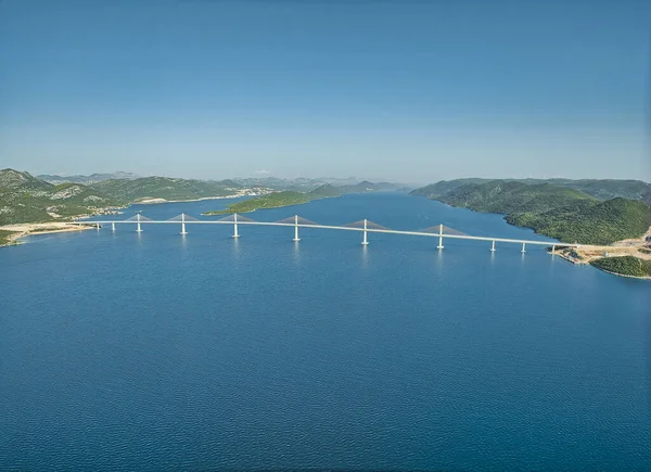 Long exposure aerial wide lens view of the Peljesac bridge, which connects the mainland with the peninsula, near Ston in Croatia