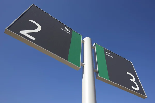 Signpost on a railway station — Stock Photo, Image