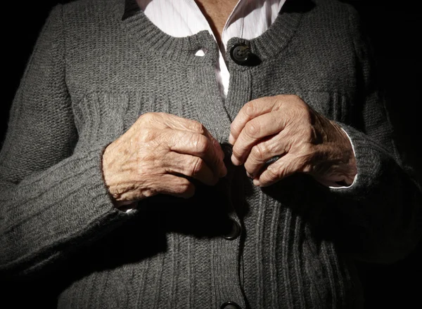 Old hands buttoning — Stock Photo, Image