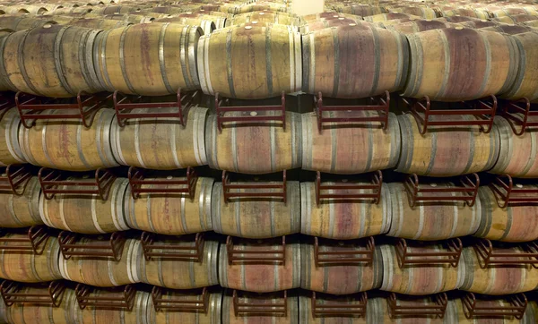 Wine barrels in an aging cellar — Stock Photo, Image