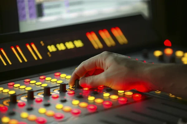 Male hand on control Film Mixing console — Stock Photo, Image