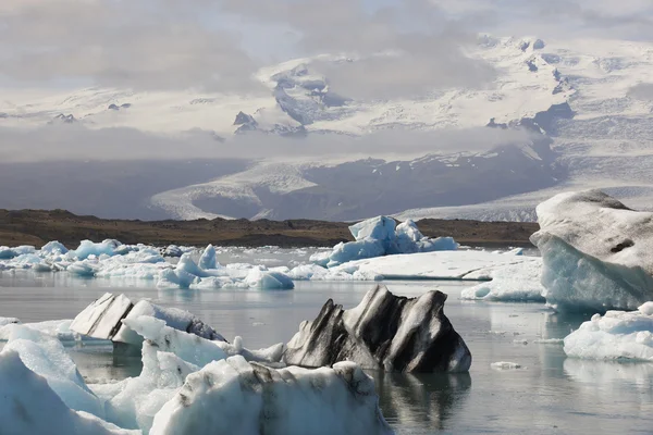 Islanda. Zona sud-est. Jokulsarlon. Iceberg, lago e ghiacciaio — Foto Stock