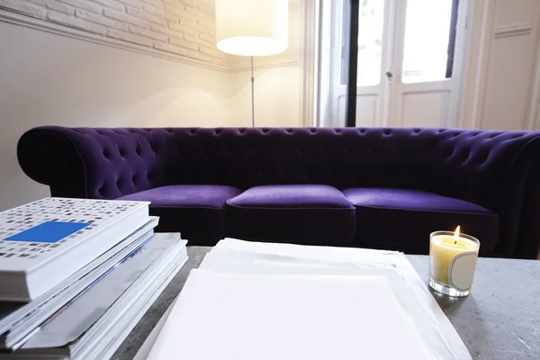 Home interior with books and sofa — Stock Photo, Image