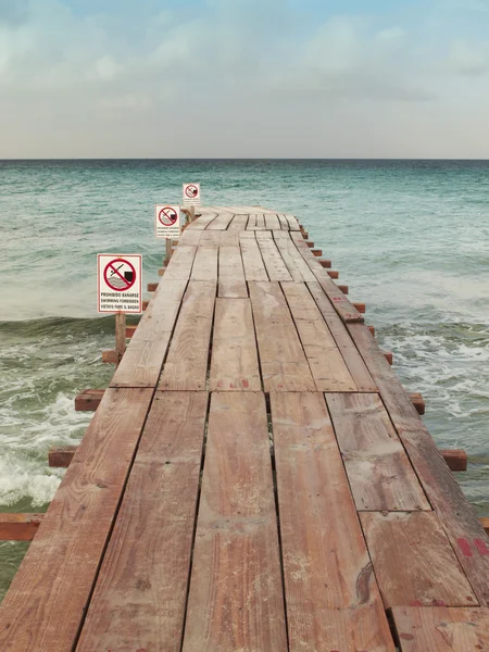 Beach dock with signals. No swimming. — Stock Photo, Image