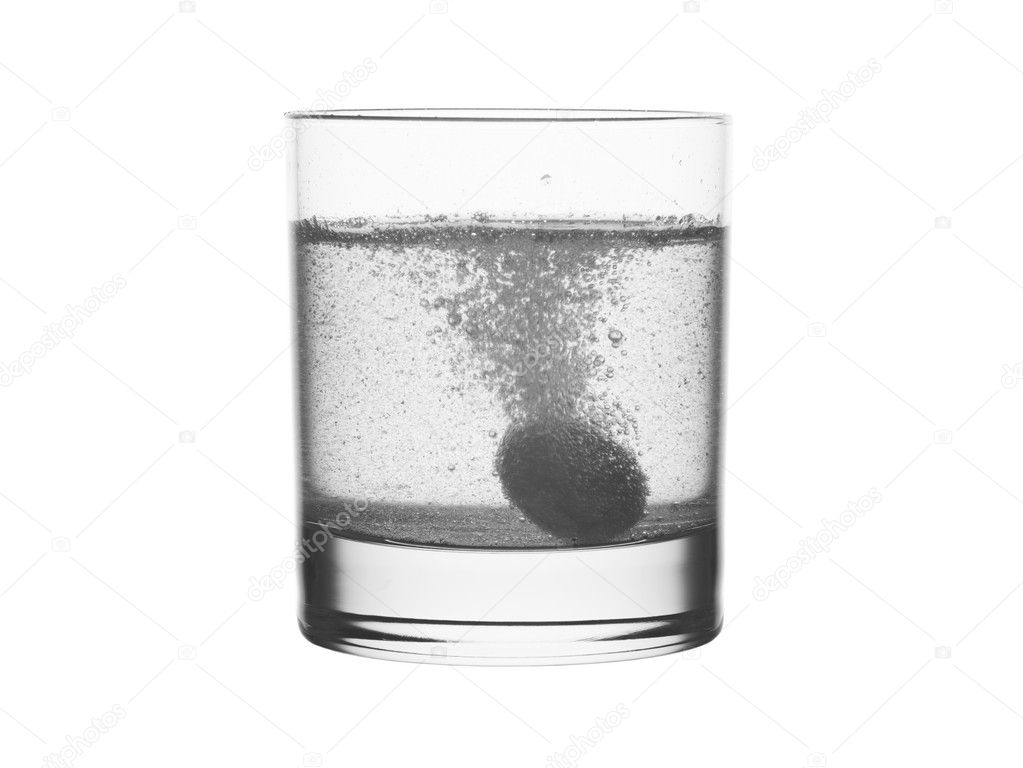 Glass of water and medicine.
