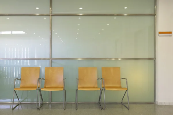 Hospital waiting area with metallic chairs. — Stock Photo, Image