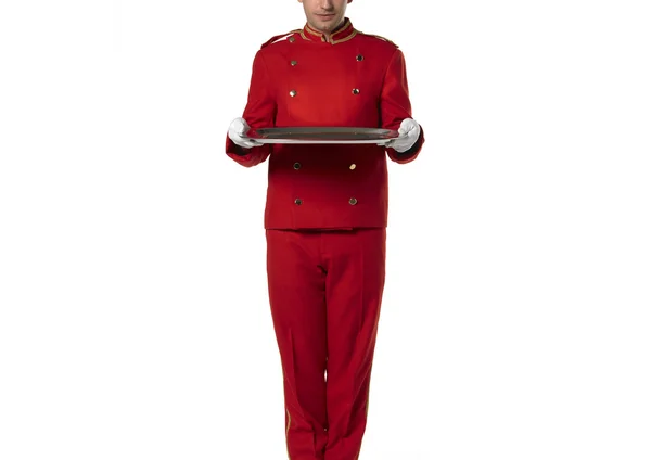 Bellboy tuta rossa con vassoio isolato su bianco — Foto Stock