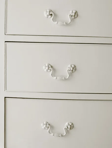 White drawers with old fashioned handles — Stock Photo, Image