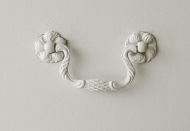 Detail of a drawer handle decorated on white clipart