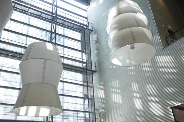 Huge lamps in a modern building interior — Stock Photo, Image