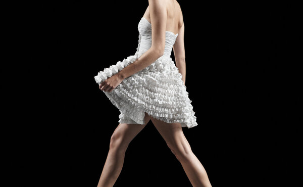 Woman dressed in white color isolated on black