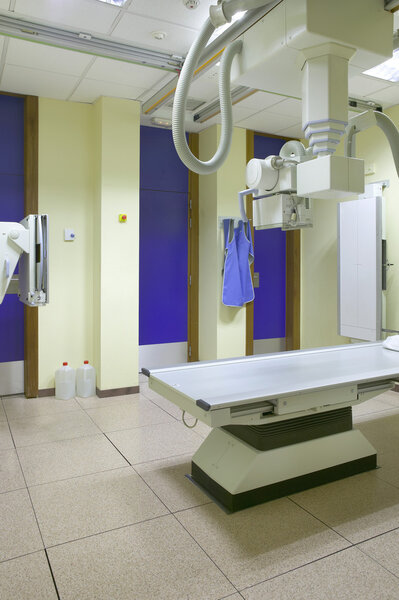 Hospital x-ray room interior with equipment 