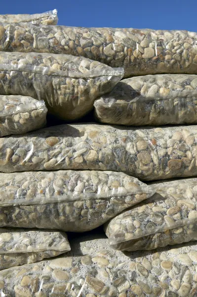 Packaged and stacked stones for industry — Stock Photo, Image