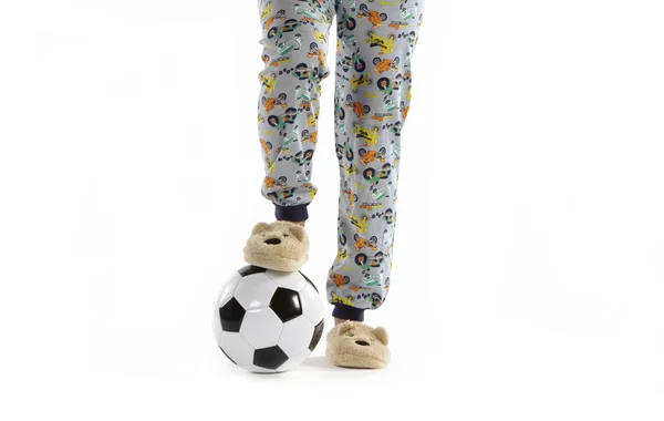 Boy dressed in pyjama and football ball — Stock Photo, Image