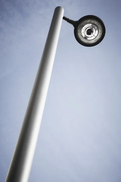 Modern street lamp under a blue sky — Stock Photo, Image