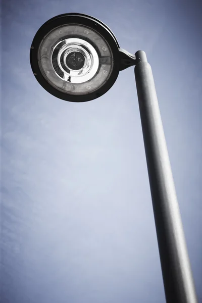 Modern street lamp under a blue sky — Stock Photo, Image