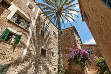 Traditional stone alley in Fornalutx village. Mallorca, Balearic islands clipart