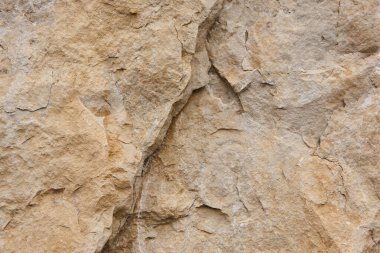 Sıcak tonda doğal taş arka plan detayı. Doku