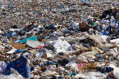 Open air garbage dump. Plastic pollution. Recycling junk. Consumerism