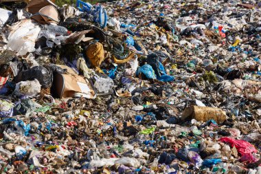 Open air garbage dump. Plastic pollution. Recycling junk. Consumerism