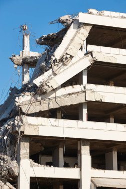 Building destroyed by earthquake. War disaster. Demolition