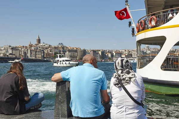 Bosphorus sea, galata tower and ottoman people. Istambul skyline. Turkey