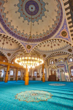 Ancient Kapi mosque illuminated interior in Konya. Anatolia, Turkey clipart