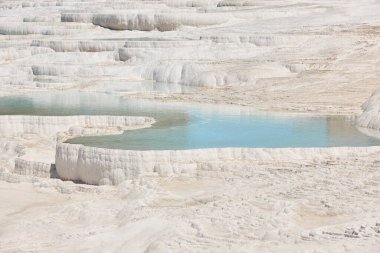 Pamukkale white mineral limestone natural pool. Geology landmark in Turkey