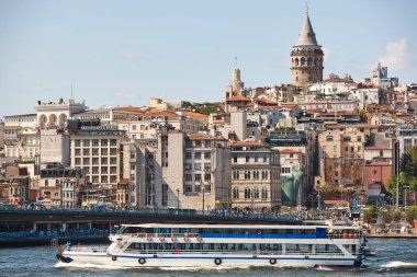 Ferry at Bosphorus strait in Istanbul. Galata tower. Turkey