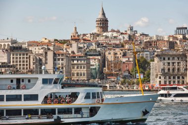Ferry at Bosphorus strait in Istanbul. Galata tower. Turkey