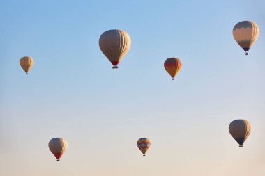 Spectacular balloons flying at sunrise in Goreme valley. Cappadocia, Turkey