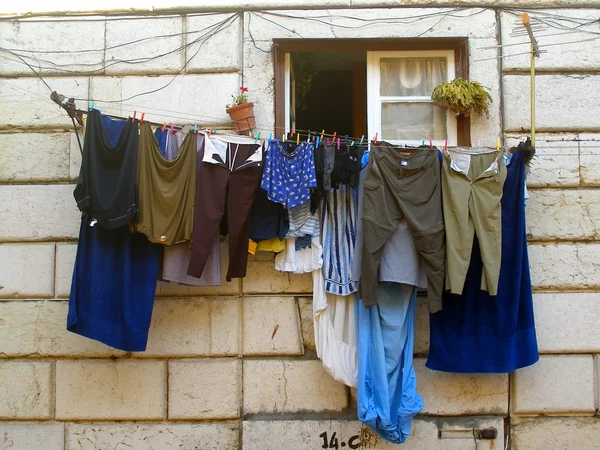 Clothes drying at the window — Stock Photo, Image