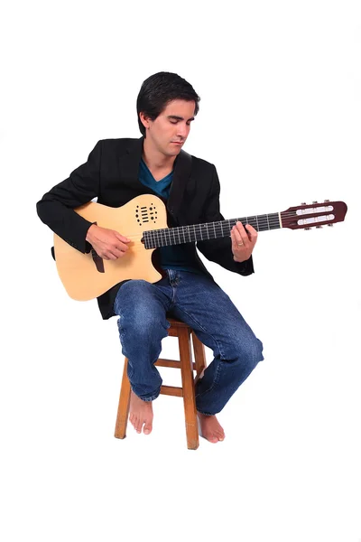 Een mannelijke guitarrist in actie — Stockfoto