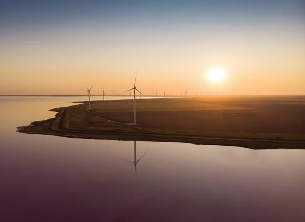 Background of wind farm on the coast of Lemurisike lake (pink lake) in Kherson district, Ukraine