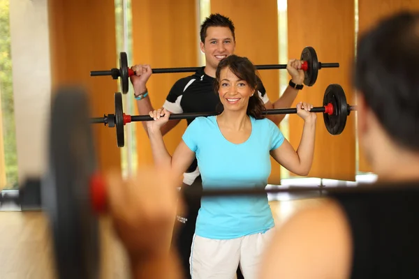 Group having fun with weightlifting — Stock Photo, Image