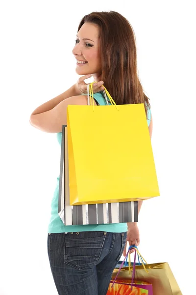 Happy woman with shopping bags and gifts Stock Image