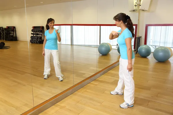 Her reflection in the mirror telling a woman to get started! — Stock Photo, Image